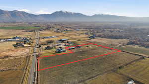 View of rural area with property parcel outlined and a mountain backdrop