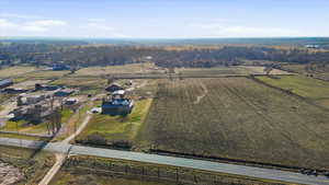 Aerial view of property and surrounding area featuring rural landscape