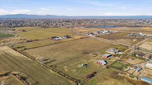 Aerial view of property's location with rural landscape and a mountain backdrop