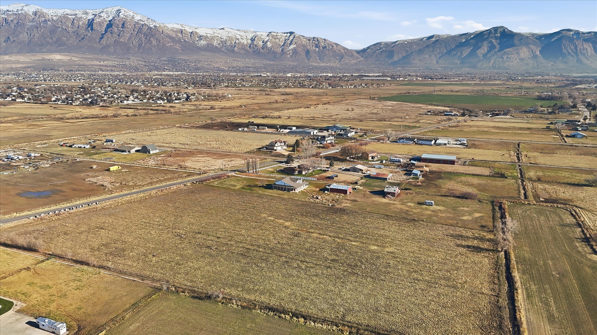 Aerial view of sparsely populated area with a mountainous background