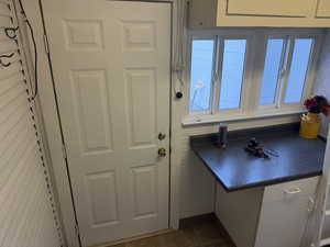 Doorway with tile patterned flooring