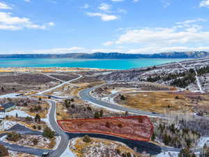 Snowy aerial view featuring a mountain view
