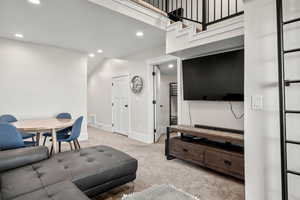 Living room featuring recessed lighting and light colored carpet