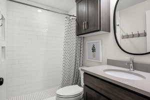 Bathroom with vanity and a stall shower