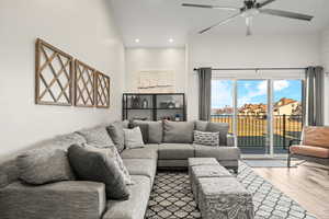 Living area with wood-type flooring, recessed lighting, and a ceiling fan