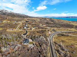 Aerial overview of property's location featuring a mountainous background