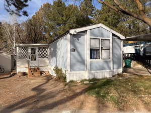 View of outbuilding with entry steps