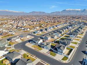 Aerial perspective of suburban area with a mountain backdrop