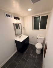 Bathroom featuring vanity and recessed lighting