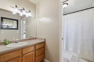 Bathroom featuring vanity and light tile patterned floors