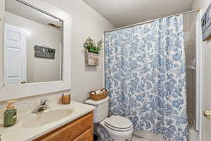 Bathroom with vanity and toilet