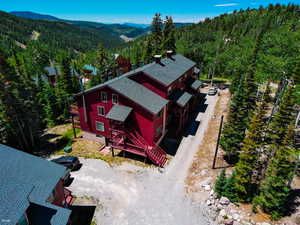 View from above of property with a mountain backdrop
