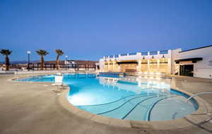 Community pool featuring a patio and a jacuzzi