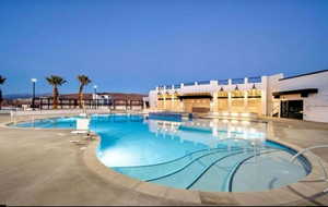 Community pool with a patio and a jacuzzi