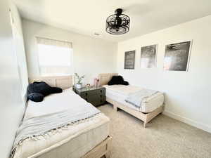 Bedroom with carpet and baseboards