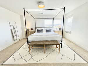 Bedroom with light carpet