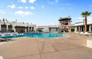 Community pool featuring a patio area