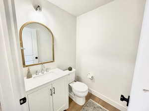 Bathroom featuring vanity and light wood finished floors
