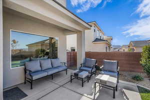 View of patio featuring an outdoor hangout area