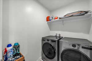 Washroom featuring separate washer and dryer