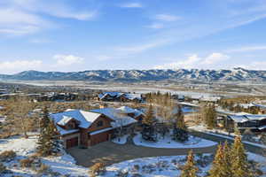 Snowy aerial view with a mountain view