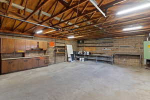 Garage with concrete block wall and a workshop area