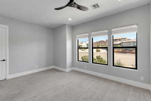 Unfurnished room featuring light carpet, recessed lighting, and ceiling fan