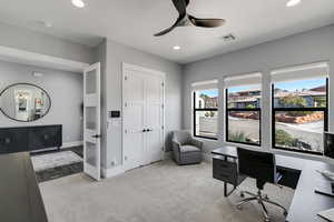Office space with ceiling fan, light carpet, and recessed lighting
