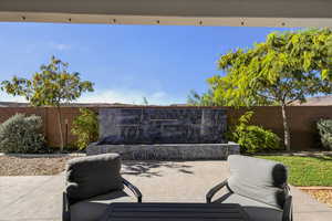 Fenced backyard with a patio area