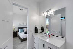 Full bathroom with vanity, light carpet, ensuite bathroom, and a shower with shower curtain