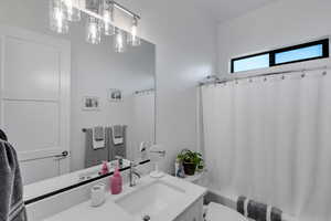 Bathroom featuring vanity and shower / tub combo