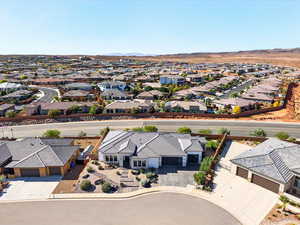 Aerial perspective of suburban area featuring a mountain backdrop