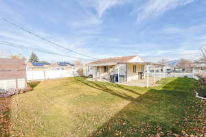 Fenced backyard with 2 sheds