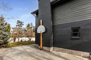 Side of home  Concrete pad for recreation or RV.