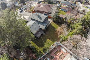 Aerial view of property and surrounding area with nearby suburban area