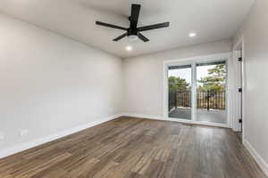 Primary bedroom with LVP flooring, a private deck and ensuite bathroom.