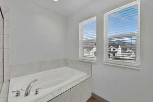 Full bathroom with a garden tub