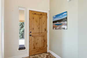 Foyer entrance featuring baseboards