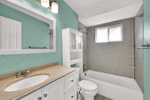 Bathroom featuring bathing tub / shower combination and vanity