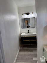 Bathroom featuring vanity and baseboards