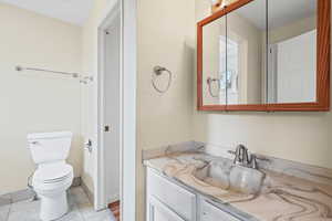 Bathroom featuring vanity and light tile patterned floors