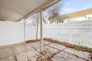 Fenced backyard featuring a patio area