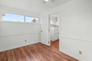 bedroom 2  with wood finished floors and ceiling fan