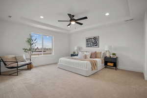 Master Bedroom with light colored carpet, a raised ceiling, ceiling fan, and recessed lighting