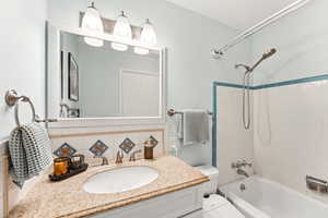 Full bathroom featuring vanity and tub / shower combination