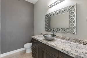 Bathroom featuring baseboards and vanity