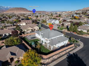 Aerial view of residential area featuring a mountainous background