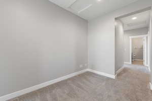 Unfurnished room featuring attic access, carpet, and recessed lighting