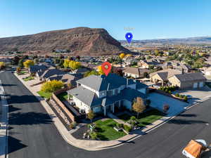 Aerial perspective of suburban area with a mountain backdrop