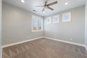 Carpeted spare room with recessed lighting and a ceiling fan